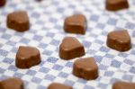 Chocolate Hearts On Fabric Stock Photo