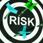 Risk On Dartboard Shows Unsafe Stock Photo