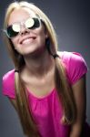 Happy Young  Woman With Sunglasses Looking At The Camera Stock Photo