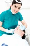 Female Dentist Examines A Patient Stock Photo