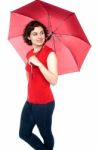 Beautiful Young Woman Holding An Umbrella Stock Photo