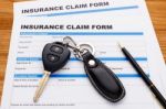 Insurance Claim Form With Car Key Stock Photo