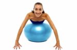 Young Lady Performing Abdomen Exercise Stock Photo