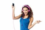 Preety Woman Listening To The Music From Smart Phone Stock Photo