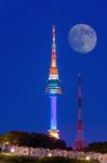 N Seoul Tower With Full Moon Located On Namsan Mountain In Central Seoul,south Korea Stock Photo