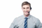 Young Employee Assisting Customer On Call Stock Photo