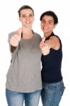 Sisters Showing Thumbs Up Stock Photo