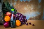 Bottles Of Juice And Fruits On A Table Stock Photo