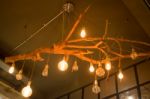 Vintage Hanging Light Bulb On Room Ceiling Stock Photo