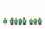 Studio Shot Of Lego Minifigure Holding Word I Love You On White Background Stock Photo