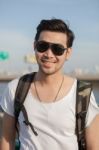 Close Up Face Of Younger Asian Man Wearing Sun Glasses Standing Outdoor Stock Photo