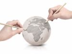 Two Hand Shade Drawing Europe Map On Paper Ball Stock Photo