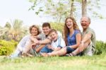 Affectionate Family Having Fun Outdoors Stock Photo