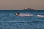 Man Riding A Jet Ski Off Dungeness Beach Stock Photo