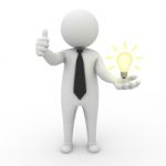 Business Man With Idea Lightbulb Stock Photo