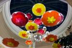 Brightly Coloured Parasols Hanging From The Ceiling Stock Photo
