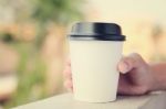 Hand Holding Take Away Coffee Cup Stock Photo