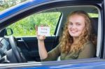 Young Dutch Woman Showing Card Driving License In Car Stock Photo
