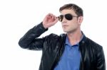 Handsome Man In Leather Jacket Looking Away Stock Photo
