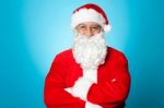 Arms Crossed Santa Claus Over Blue Background Stock Photo