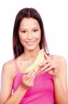 Woman Holding Slice Of Yellow Melon Stock Photo