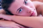 Young Woman Laying On Massage Bed Stock Photo