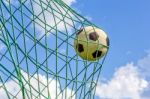Football Shot In Goal Net Stock Photo