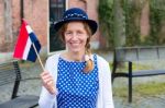 European Woman Celebrating Liberation With Dutch Flag Stock Photo