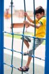 Young Boy On Playstructure Stock Photo