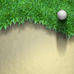 White Golf Ball On Green Grass Stock Photo