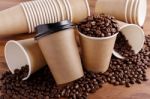 Paper Coffee Cups With Beans Stock Photo