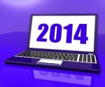 Two Thousand And Fourteen On Laptop Shows Year 2014 Stock Photo