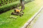 People Are Using Lawn Mowers Stock Photo