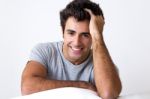 Happy Young Man Relaxing At Home Stock Photo