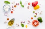 The Ingredients For Homemade Pizza On White Wooden Background Stock Photo