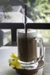 Iced Coffee Latte On Balcony Wooden Table Stock Photo