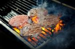 Beef Burgers On Barbeque Stock Photo