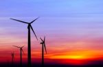 Wind Turbine Silhouette On Colorful Sunset Stock Photo
