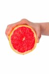 Hand Squeezing An Orange Stock Photo