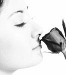 Girl Smelling A Rose From Her Boyfriend Stock Photo