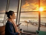 Woman With Smart Phone In Hand Standing In Airport Terminal Building And Airliner Plane Departure On Runway Stock Photo