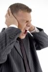 Side Pose Of Shouting Businessman Stock Photo