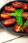 Baked Cherry Tomatoes With Basil Anf Thyme Stock Photo