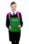 School Girl Holding Large Green Calculator Stock Photo