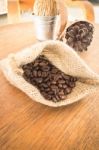 Coffee Roasted Bean On Wooden Table Vintage Style Stock Photo