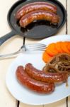 Beef Sausages Cooked On Iron Skillet Stock Photo