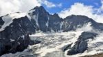 Peak Großglockner . Austrian Alps. Peak Großglockner-3798 M.  Is The Highest In The Austrian Alps. From Him Leaving The Glacier "pasterze" Stock Photo