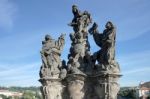 Statue Of Saints Dominic And Thomas On Charles Bridge In Prague Stock Photo