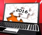 Two Thousand And Sixteen On Laptop Shows New Years Resolution 20 Stock Photo