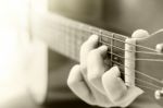 Woman's Hands Playing Acoustic Guitar With Vintage Filter Stock Photo